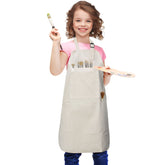 FreeNFond kids apron with four pockets centered for quick tool access during baking