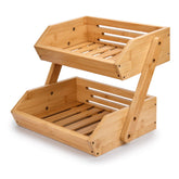 G.a HOMEFAVOR two-tier bamboo fruit basket on a kitchen counter offers ample storage.