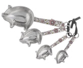 Ganz measuring spoons set with pig design and floral accents for playful cooking