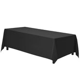 Gee Di Moda rectangle tablecloth in black draped over a 6-foot table for formal dining