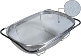 Generic premium stainless-steel colander over the sink with adjustable rubber grip handles for easy rinsing.