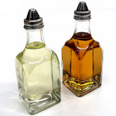 Glass oil and vinegar dispenser set with square bottles for organized countertops and easy pouring