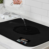 GORILLA GRIP dish drying mat close-up shows absorbent foam and water droplets.