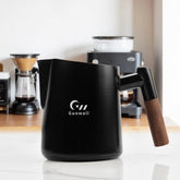 Guowall milk frothing pitcher in stainless steel with black handle, for premium home café use