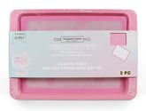 Handstand Kitchen Hello Kitty baking sheet with 50th anniversary pink finish, perfect for cookies.