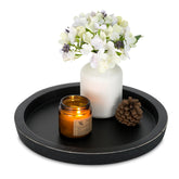 Hanobe wooden round tray for coffee-table display with elegant candle holder.