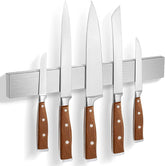 HEREOF Knife Magnetic Strip on wall keeps blades secure and accessible.