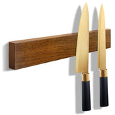 HEREOF wooden knife strip on wall provides secure knife storage and easy access.
