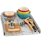 HOLDN’ STORAGE pull-out cabinet organizer in chrome offers easy access to stored spices.