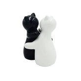 Holitika cat salt and pepper shakers in hugging cat design for stylish table seasoning.