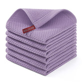 Homaxy lavender cotton waffle dishcloth in use for drying cookware and glassware.