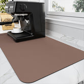 HotLive coffee mat absorbs spills quickly on a busy kitchen counter.