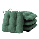 IPYNBAP four-pack dining chair cushions fitted securely on chairs.