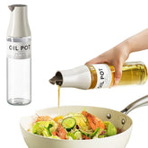 JANSSE olive oil dispenser tilt-top showing drip-free pouring in a modern kitchen