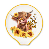 JarThenaAMCS Highland cow spoon rest with watercolor sunflowers and butterflies for elegant kitchen display.