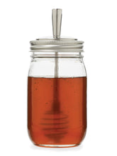 Jarware honey dipper lid on a regular-mouth jar for neat dispensing.