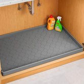 Jin&Bao under-sink mat 28x22 provides full cabinet protection against leaks.