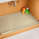 Jin&Bao under-sink mat with raised edge protecting cabinets from leaks