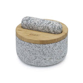 Joseph Joseph Dash pestle mortar set with bamboo lid in gray, ready for grinding spices.