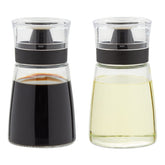Juvale glass oil and vinegar dispenser set in a stylish 2-pack for mess-free pouring.