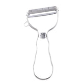 Kai Select 100 T-Peeler blade close-up shows a sharp stainless steel edge for quick peels.
