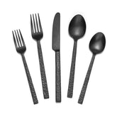 Kingstone 30-piece black hammered silverware set on table ready for family dinners.