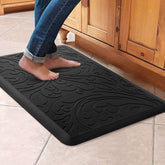 KMAT kitchen mat cushions feet, offering anti-fatigue support during long cooking sessions.