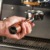 KNODOS 54mm bottomless portafilter with rosewood handle for precise, leak-free extraction