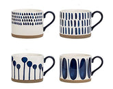 Koja hand-painted mug set on display with four decorative mugs for daily coffee rituals.