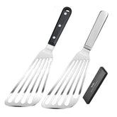 KSENDALO fish spatula with slotted blade gliding under a fillet for delicate flipping.