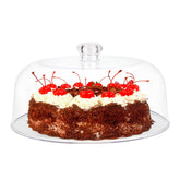 KVMORZE 11-inch clear cake dome cover over a cake, keeping dessert dust-free while displayed.