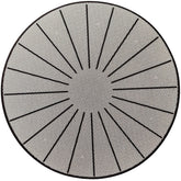 Lazy K induction mat on stovetop providing surface protection and non-slip stability during cooking.
