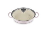 Le Creuset Signature round braiser in Shallot with lid on for even heat distribution.