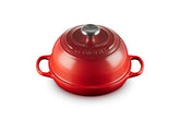 Le Creuset Bread Oven Cerise full view shows vibrant color and iconic silhouette.
