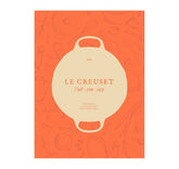 Le Creuset Cookbook cover highlights durable design for kitchen inspiration.