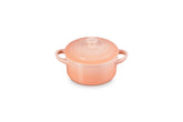 Le Creuset mini cocotte Peche with heart knob for sharing delightful desserts.