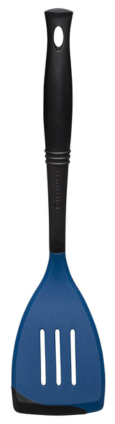 Le Creuset Revolution slotted spatula bi-material head for safe, easy turning of delicate foods.