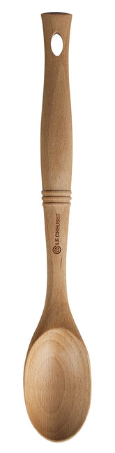 Le Creuset Revolution Solid Spoon with elliptical grip for precise stirring and comfortable control.