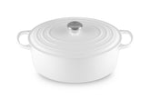 Le Creuset Signature oval Dutch oven 8qt white, ideal for stove-to-table cooking.