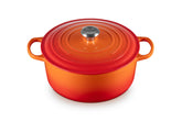 Le Creuset Signature 7.25 qt Dutch oven exterior in Flame preserves heat for even cooking.