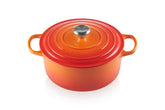Le Creuset Signature Dutch Oven in Flame color showing vibrant exterior and heat retention