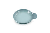 Le Creuset signature spoon rest Sea Salt with a vibrant glaze for easy daily use.