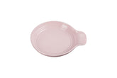 Le Creuset spoon rest round 6-inch chiffon pink keeps countertops clean during cooking.