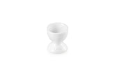Le Creuset stoneware egg cup in white for elegant serving.