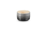 Le Creuset oyster-glazed stoneware ramekin ready for individual desserts and elegant presentation.