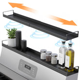 Linda's Essentials extendable stovetop shelf 16-30 inch showing built-in storage for spices and oils.