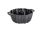 Lodge cast iron fluted cake pan with full setup, shows even bake potential
