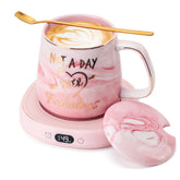 LOUTYTUO coffee mug warmer on a desk with four temperature settings for steady warmth