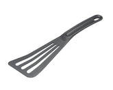 Matfer Exoglass slotted spatula in grey for easy release on nonstick cookware.