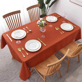 Maxmill Jacquard Swirl tablecloth in rust, ideal for festive fall gatherings.
